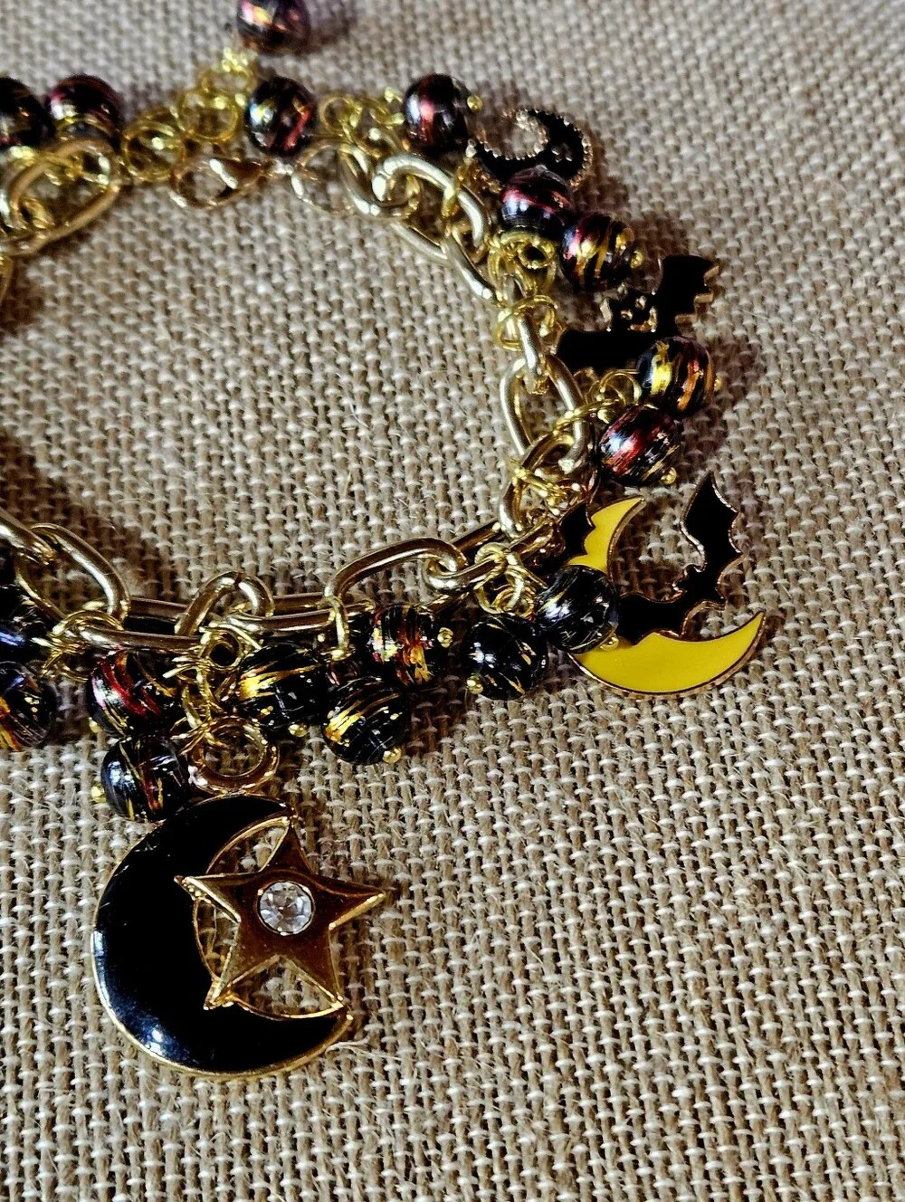 Gold-Tone Moon, Stars And Black Bats Charm Bracelet in Black and Yellow - Picture 5 of 8